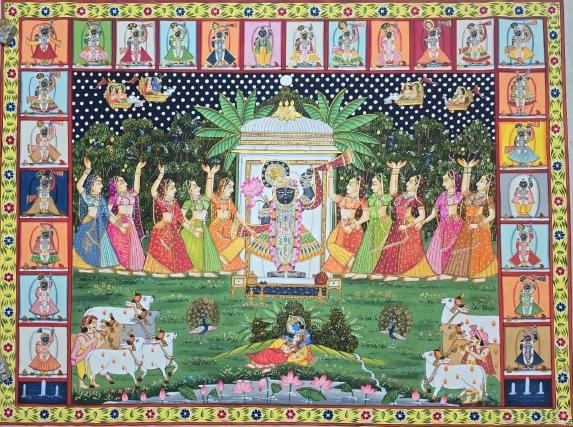 AS - Vibrant Pichwai painting featuring Shreenathji surrounded by graceful gopikas in celebration, with divine scenes, cows, and lush detailing across the composition.